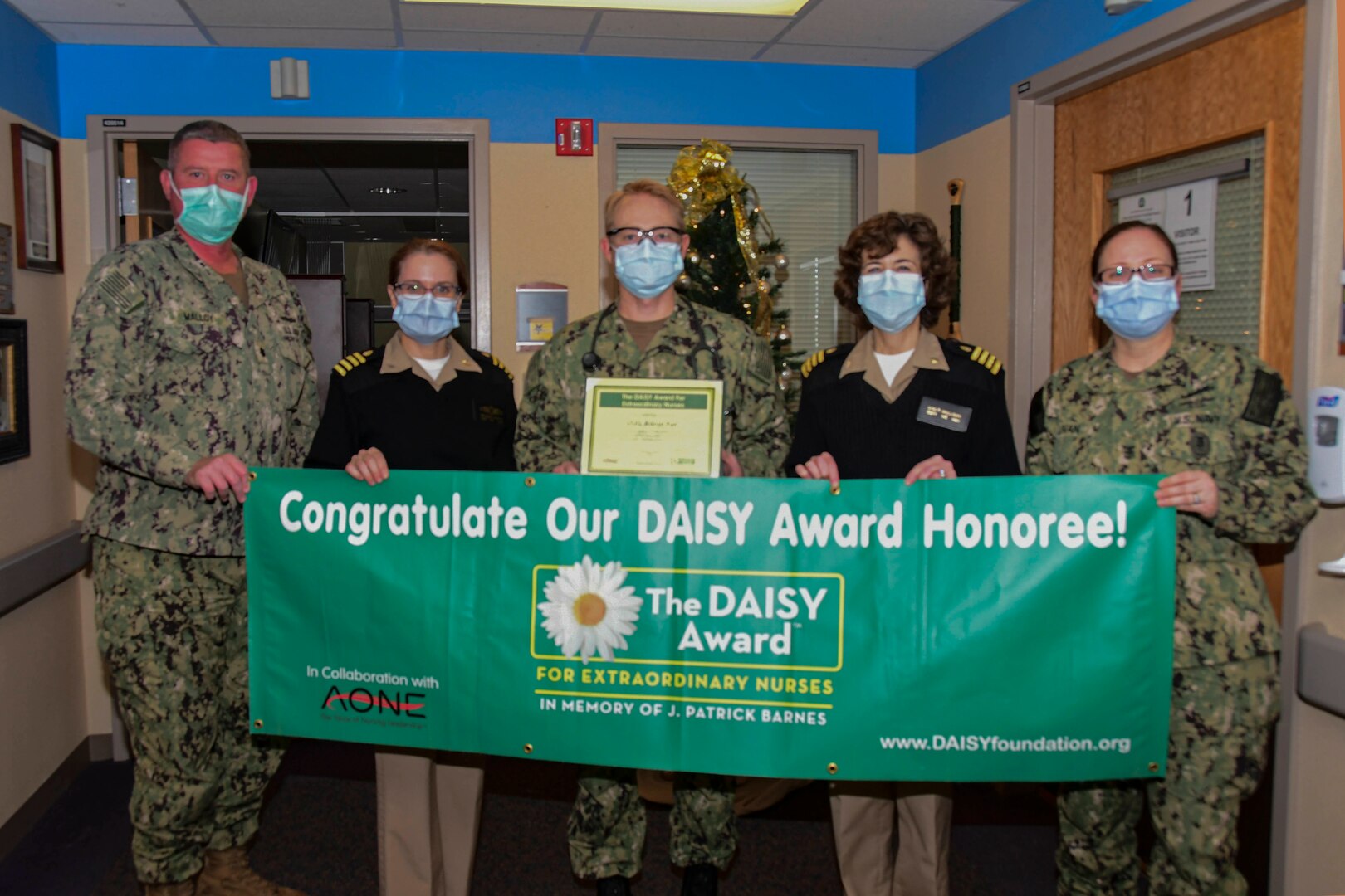 Ensign Aaron Furr, a Naval Medical Center Portsmouth (NMCP) registered nurse assigned to the Multiservice Ward (4H), was surprised with NMCP’s DAISY Award during a ceremony Dec. 22.