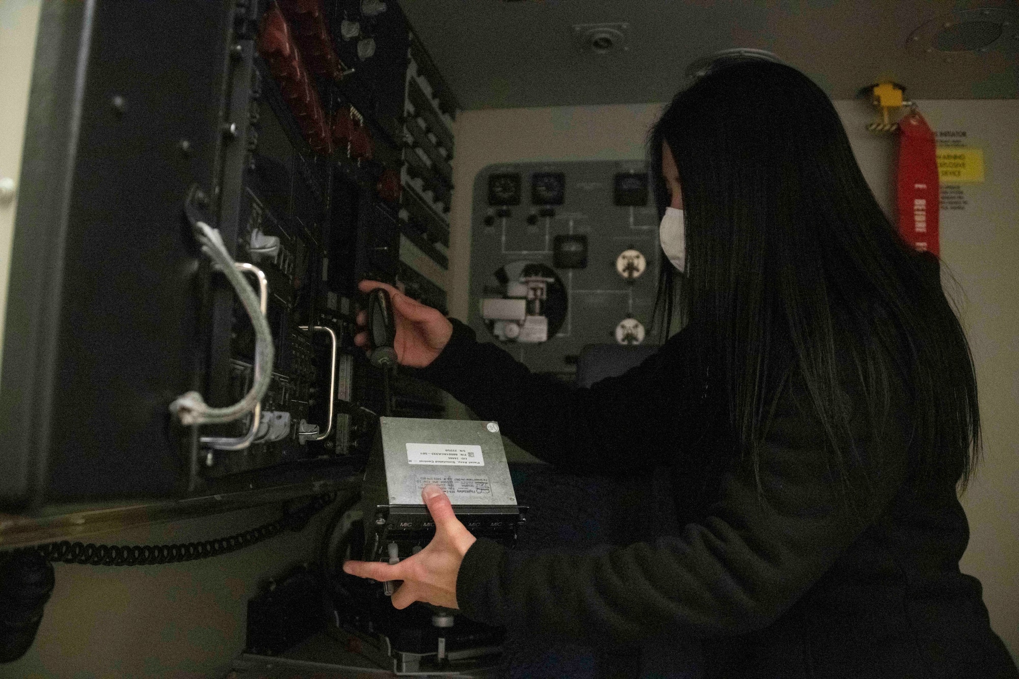 man sits a computer desk