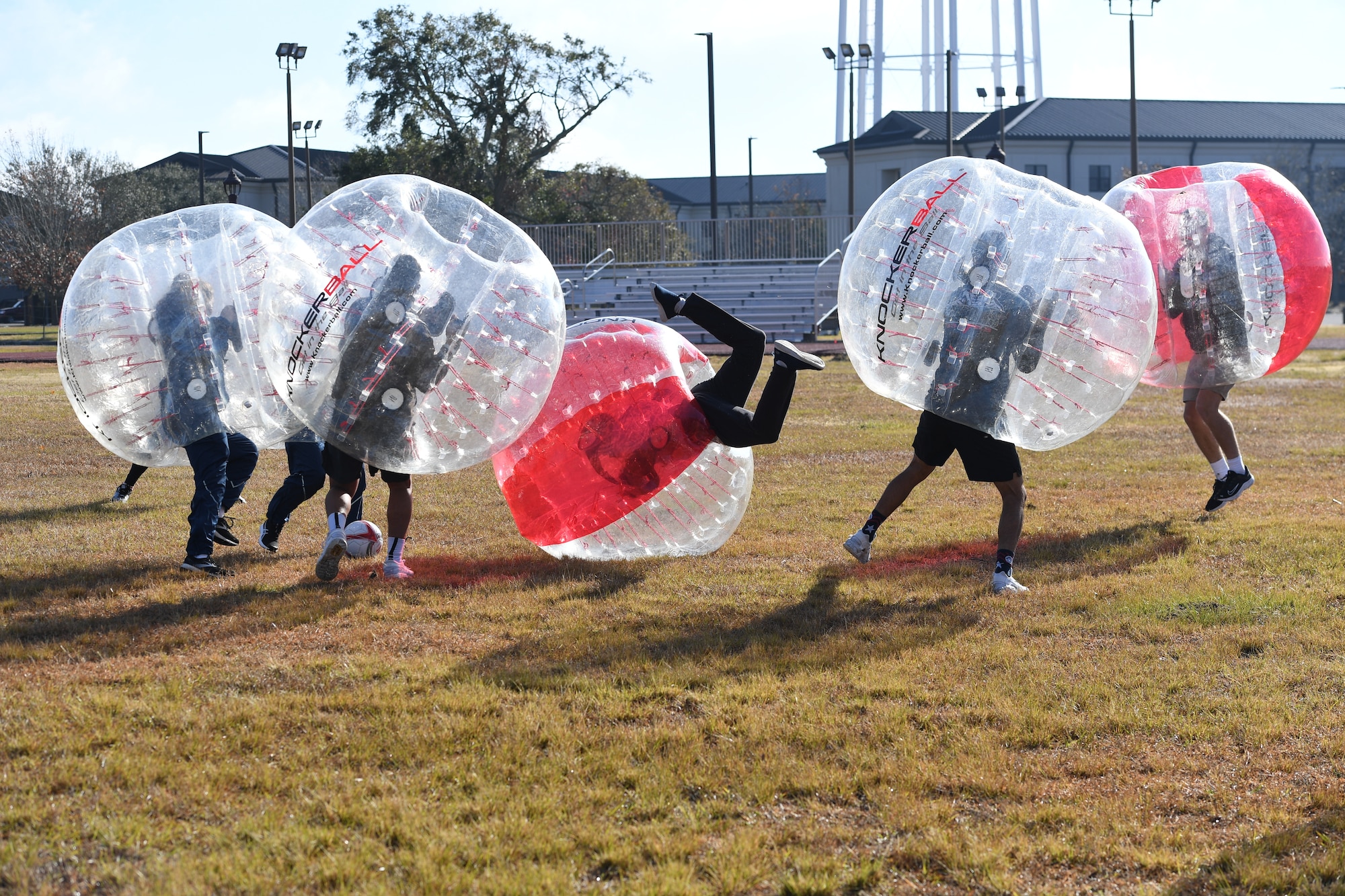 Airmen from the 81st Training Group participate in a bubble ball soccer tournament at Keesler Air Force Base, Mississippi, Dec. 21, 2020. The 81st TRG held various events for Airmen to participate in throughout the holidays, to include ice skating, inflatables, a scavenger hunt and a bubble ball soccer tournament. (U.S. Air Force photo by Kemberly Groue)
