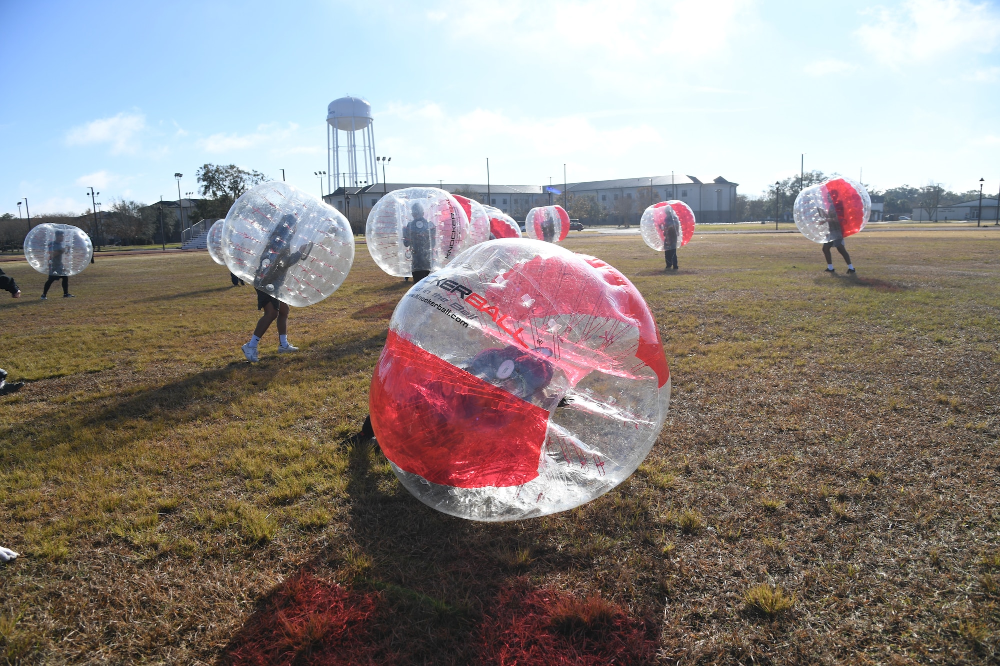 Airmen from the 81st Training Group participate in a bubble ball soccer tournament at Keesler Air Force Base, Mississippi, Dec. 21, 2020. The 81st TRG held various events for Airmen to participate in throughout the holidays, to include ice skating, inflatables, a scavenger hunt and a bubble ball soccer tournament. (U.S. Air Force photo by Kemberly Groue)