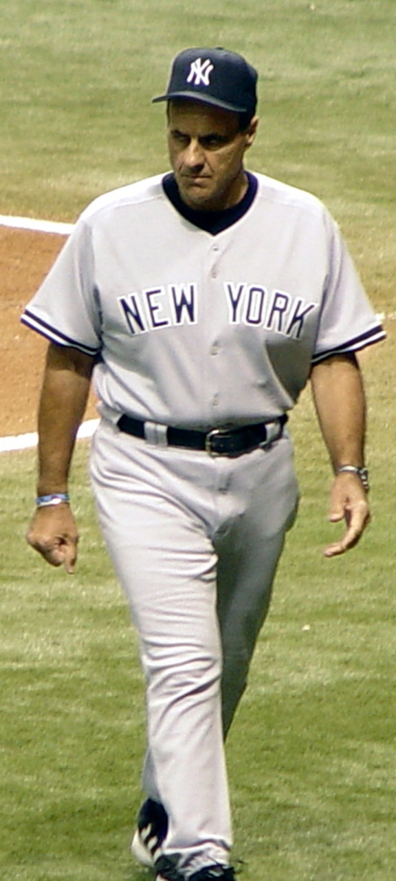 A man walks on a baseball field.