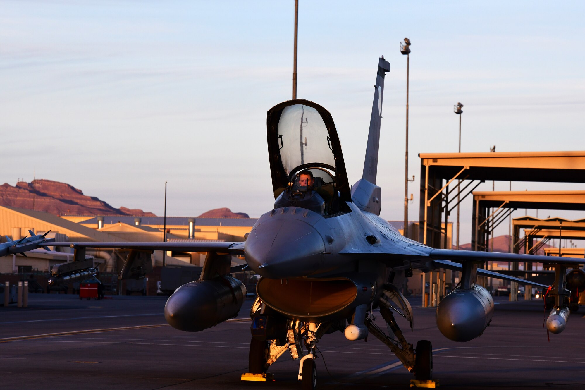 Lt. Col. Stephen Graham, 84th TES electronic warfare test director, prepares for flight to conduct Force Development Evaluations of multiple systems on the F-16, Dec. 15, Nellis Air Force Base, Nev. (U.S. Air Force Photo by Staff Sgt. Paige Yenke)
