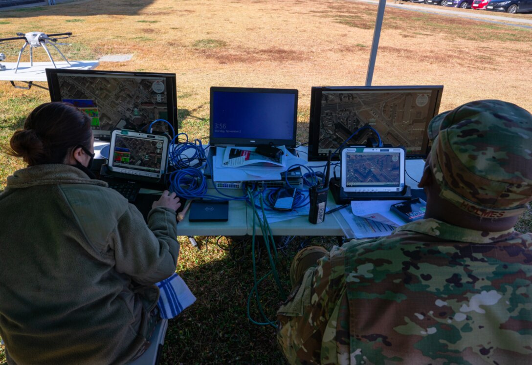 Staff Sgt. Jason Holmes and Senior Airman Clara Song, 51st Civil Engineer Squadron construction inspectors, operate drones to inspect roofs across Osan Air Base, Nov. 2, 2020. The two set an Air Force benchmark by reducing the inherent dangers associated with the roof inspection process through the use of drones to perform the annual duty. The 51st CES worked closely with the 51st Operations Support Squadron to ensure the continued safety of the airfield while operating the non-standard procedure. (U.S. Air Force photo by 1st Lt. Daniel de La Fé)