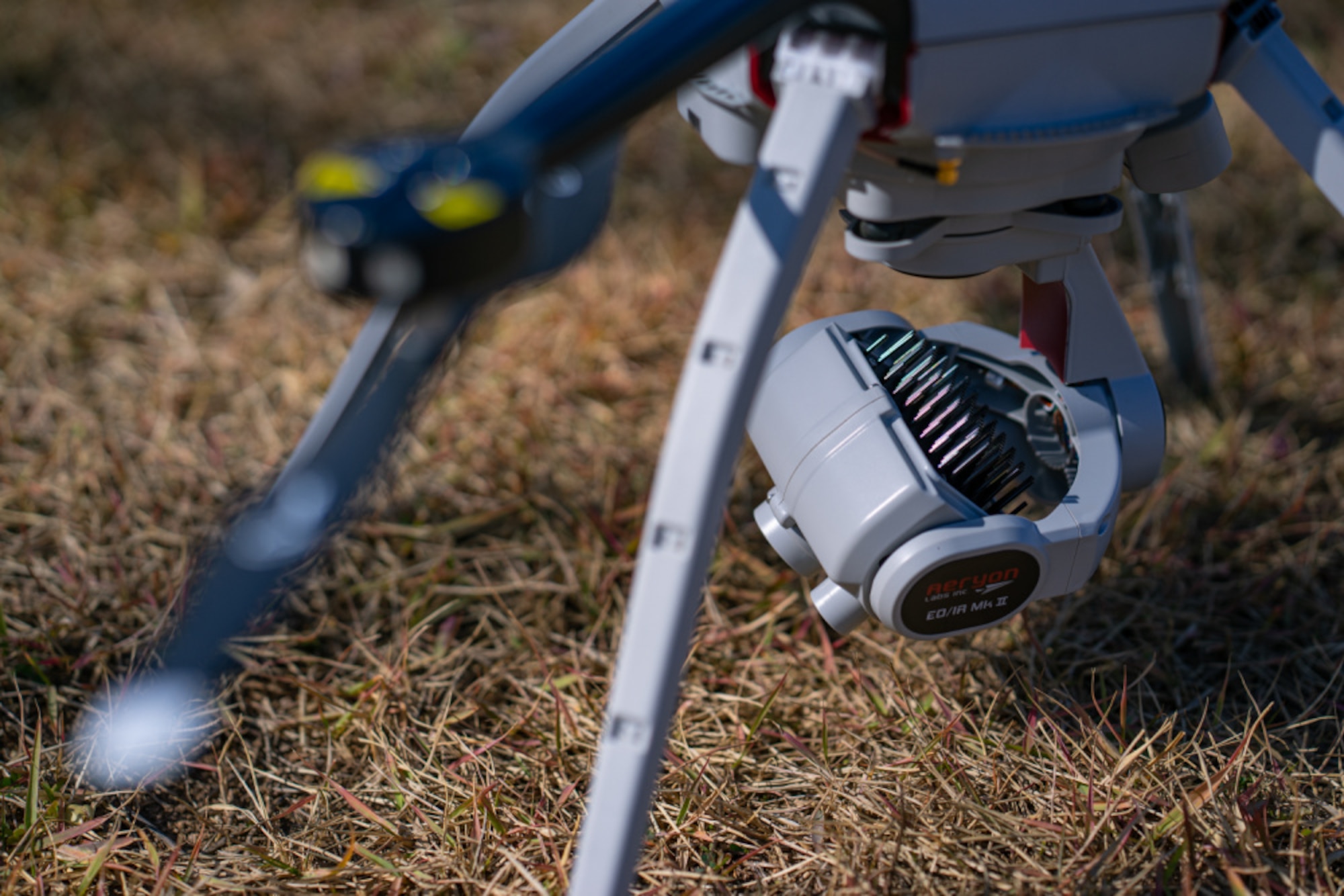 A drone’s camera powers on to prepare for an annual roof inspection flight in a field outside Osan Air Base’s Turumi Lodge, Nov. 2, 2020. The 51st Civil Engineer Squadron is utilizing drones for the first time to perform roof inspections, which are normally performed by dozens of Airmen with fall hazard, harness, and various other safety training. (U.S. Air Force photo by 1st Lt. Daniel de La Fé)