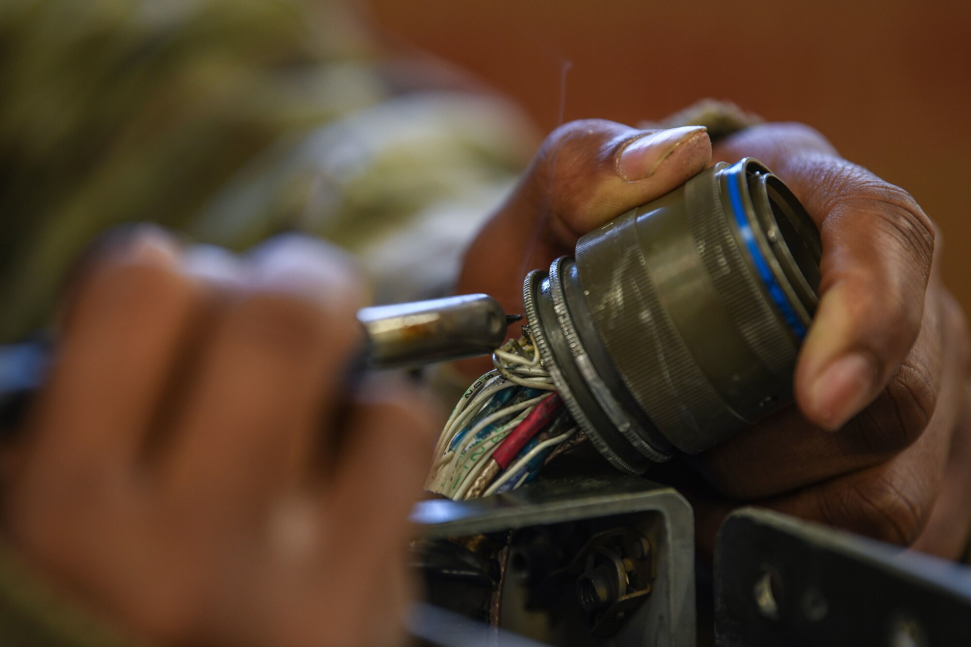 Senior Airman Timothy Strawther, 31st Munitions Squadron armament technician, solders a wire on a on a LAU-129 missile rail launcher at Aviano Air Base, Italy, Dec. 21, 2020.The 31st MUNS maintains and supports assigned weapon storage and security systems and complies with required standards. Airmen from the 31st MUNS armament flight provide munitions and armament support for approximately 50 U.S. Air Force F-16 Fighting Falcons. (U.S. Air Force photo by Airman 1st Class Ericka A. Woolever)