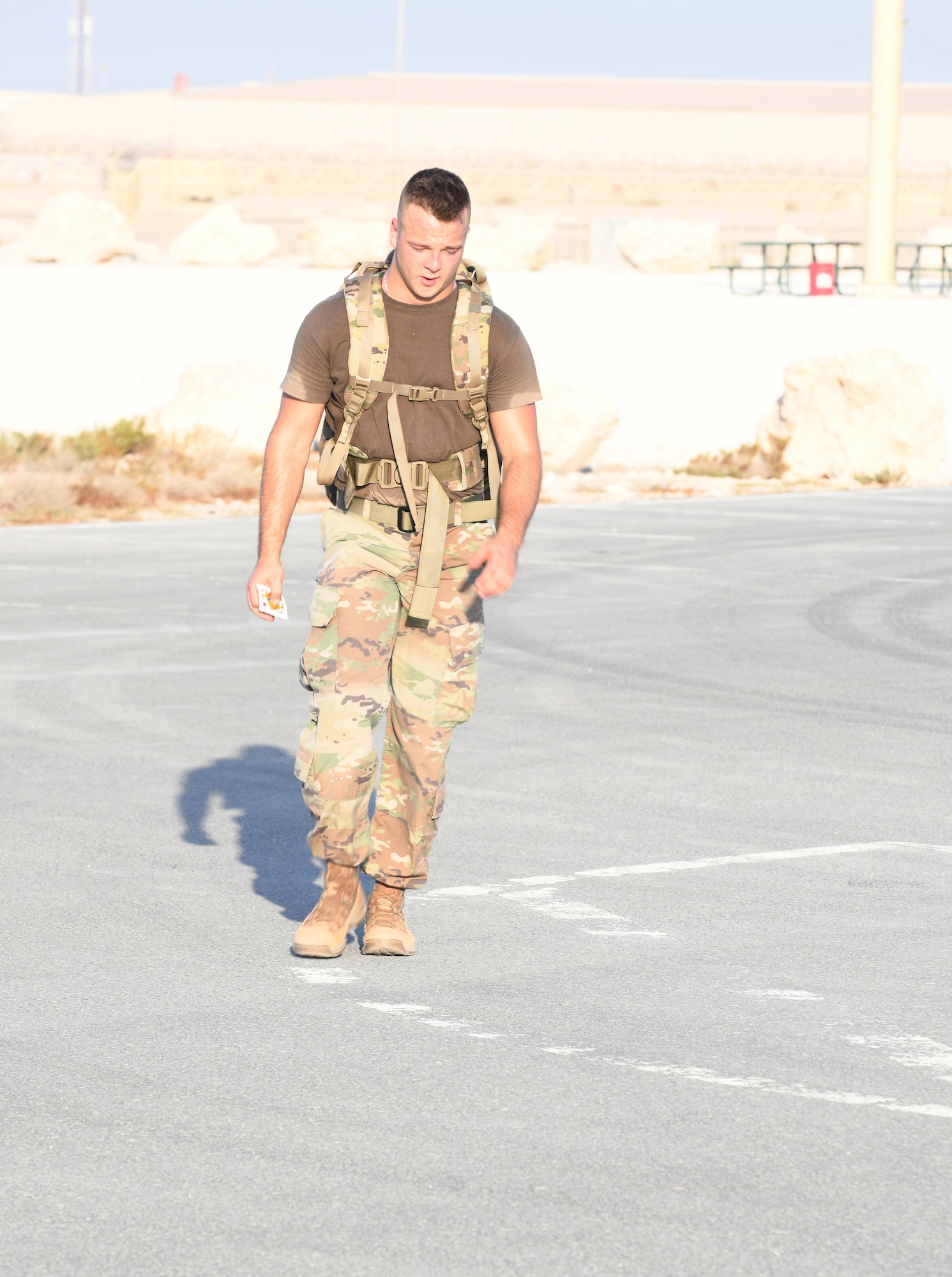 U.S. Army Private 1st Class Isaac Vieau, an ammunition supply specialist, 395th Ordnance Company, deployed to Al Udeid Air Base, Qatar, participates in the traditional 30-kilometer (18.6-mile) Norwegian foot march event Dec. 5, 2020. The tradition began in 1915, 10 years after Norway gained its independence from Sweden and has become a rite of passage for all Norwegian military members. Vieau was one of nearly 120 coalition members, including Americans, Australians, New Zealanders, British and Canadians who participated in the march under the supervision of Norwegian armed forces Capt. Magne Rambo, deployed to Al Udeid AB as part of the U.S. Central Command Partner Integration Enterprise. (U.S. Air Force photo by Staff Sgt. Kayla White)