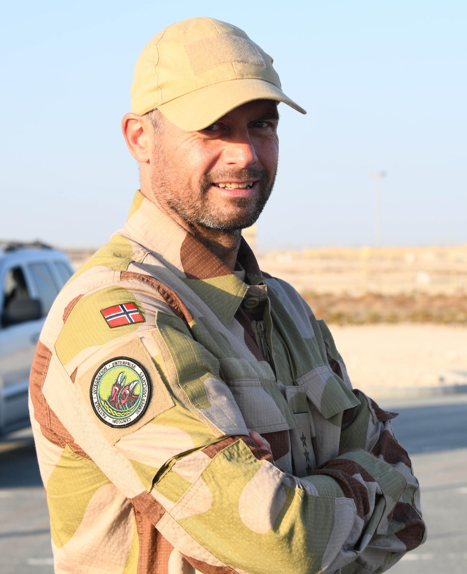 Norwegian armed forces Capt. Magne Rambo, deployed to Al Udeid Air Base, Qatar, as part of the U.S. Central Command Partner Integration Enterprise, poses for a photo at the Norwegian foot march progress checkpoint Dec. 5, 2020. Rambo supervised the event, a Norwegian military tradition dating back to 1915, 10 years after their independence from Sweden, which brought together nearly 120 other coalition members, including Americans, Australians, British and Canadians, and New Zealanders for a 30-kilometer (18.6-mile) challenge. (U.S. Air Force photo by Staff Sgt. Kayla White)