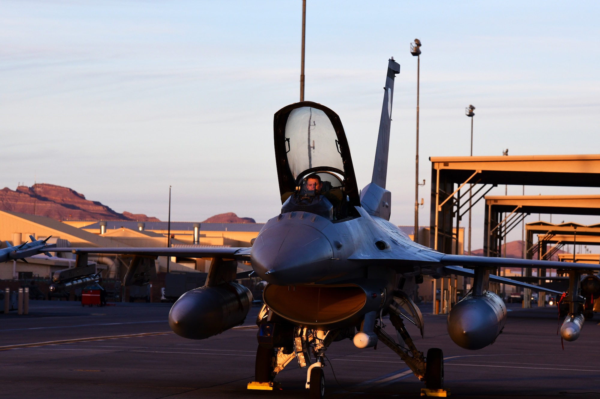 Lt. Col. Stephen Graham, 84th TES electronic warfare test director, prepares for flight to conduct Force Development Evaluations of multiple systems on the F-16, Dec. 15, Nellis Air Force Base, Nev. (U.S. Air Force Photo by Staff Sgt. Paige Yenke)