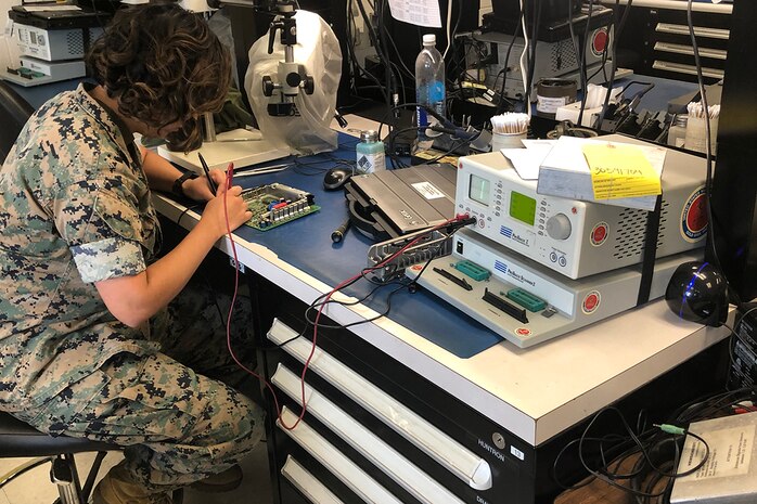 A U.S. Marine operates the legacy Circuit Card Assembly Test Station, aboard Camp Lejeune, North Carolina, Oct. 30.
