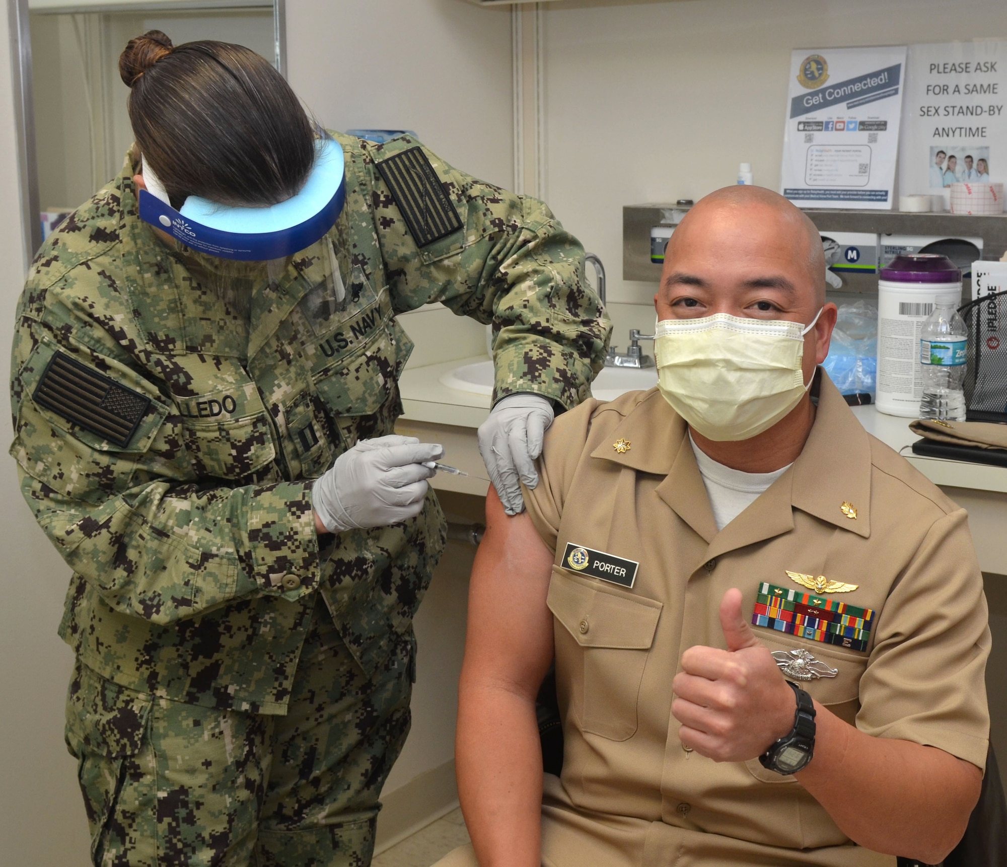 Lt. Cmdr. Ian Porter, an aviation medicine physician, receives COVID-19 vaccine at Naval Hospital Jacksonville on Dec. 18.