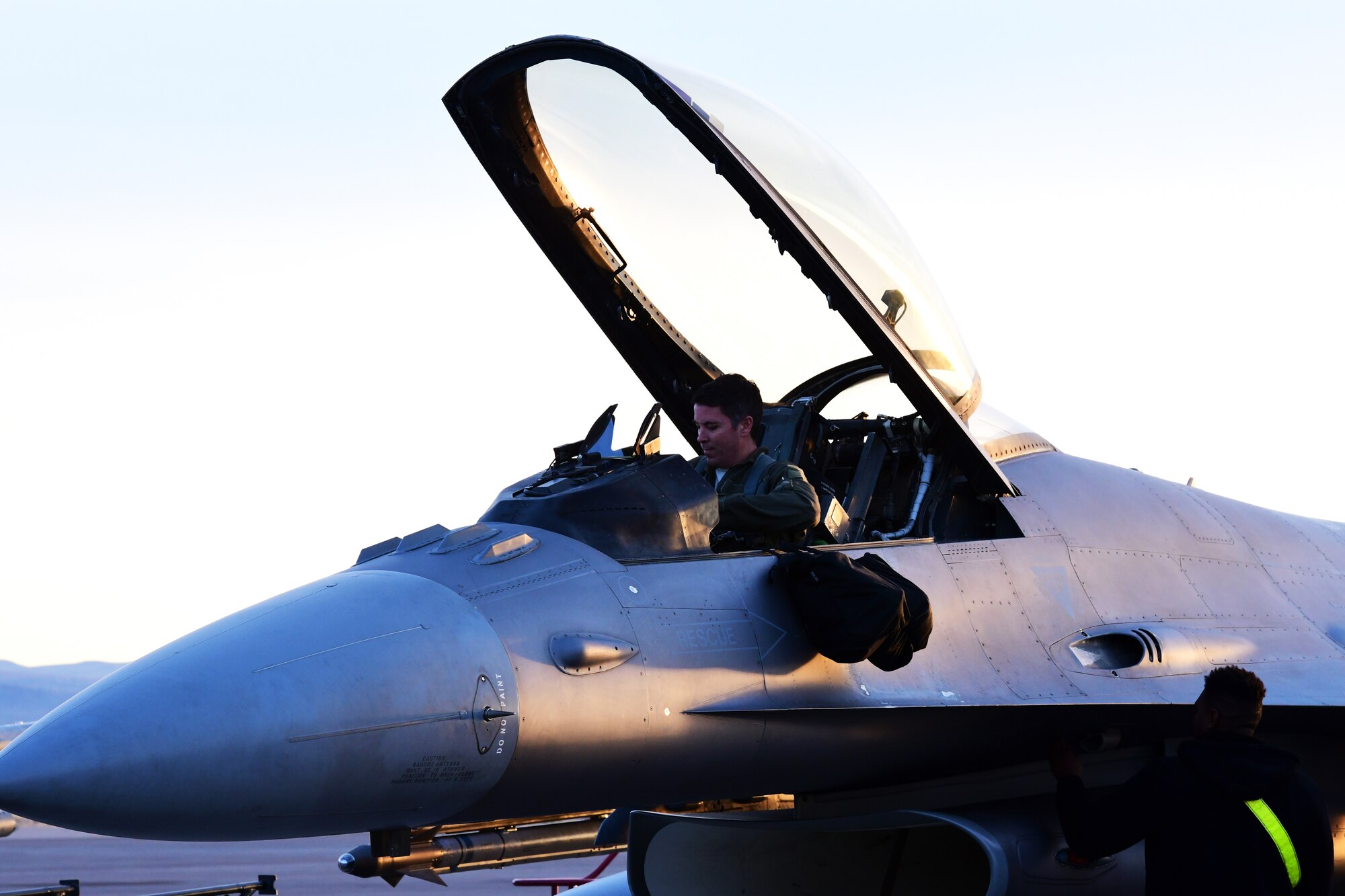 Maj. Christopher Arnott, 84th TES F-16 operational test and evaluation instructor pilot, prepares for flight to conduct Force Development Evaluations of multiple systems on the F-16, Dec. 15, Nellis Air Force Base, Nev. (U.S. Air Force Photo by Staff Sgt. Paige Yenke)