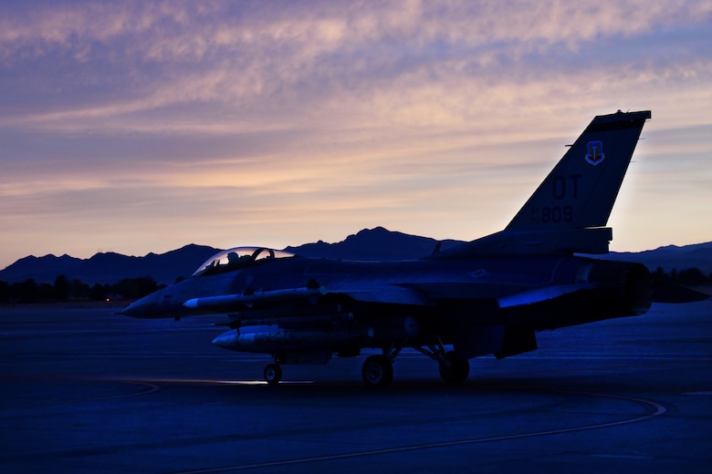 Lt. Col. Stephen Graham, 84th TES electronic warfare test director, taxis on the flight line as he prepares to conduct Force Development Evaluations of multiple systems on the F-16, Dec. 15, Nellis Air Force Base, Nev. (U.S. Air Force Photo by Major Mike Giaquinto)