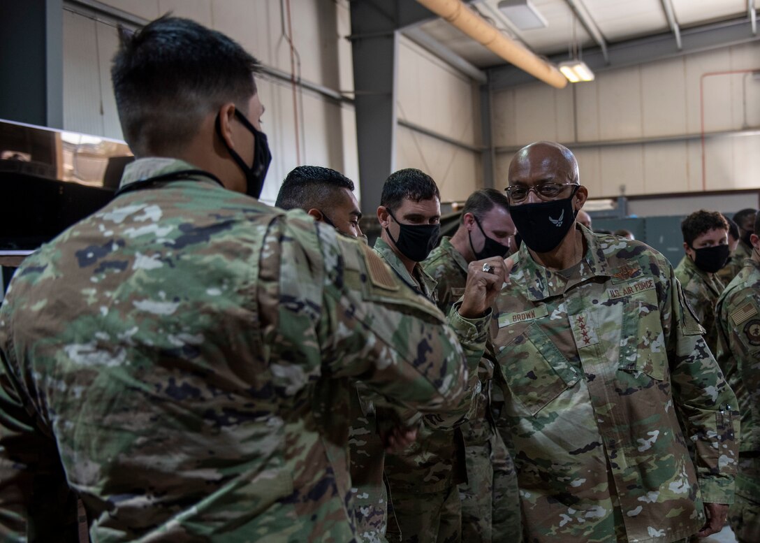 U.S. Air Force Chief of Staff Gen. Charles Q. Brown, Jr. greets 386th Expeditionary Aircraft Maintenance Squadron members during a tour at Ali Al Salem Air Base, Kuwait, Dec. 22, 2020. Senior leaders gained insight about ASAB’s mission as the tactical airlift hub and gateway for delivering combat power to joint and coalition forces in the U.S. Central Command area of responsibility. (U.S. Air Force photo by Tech. Sgt. Kaleb Mayfield)