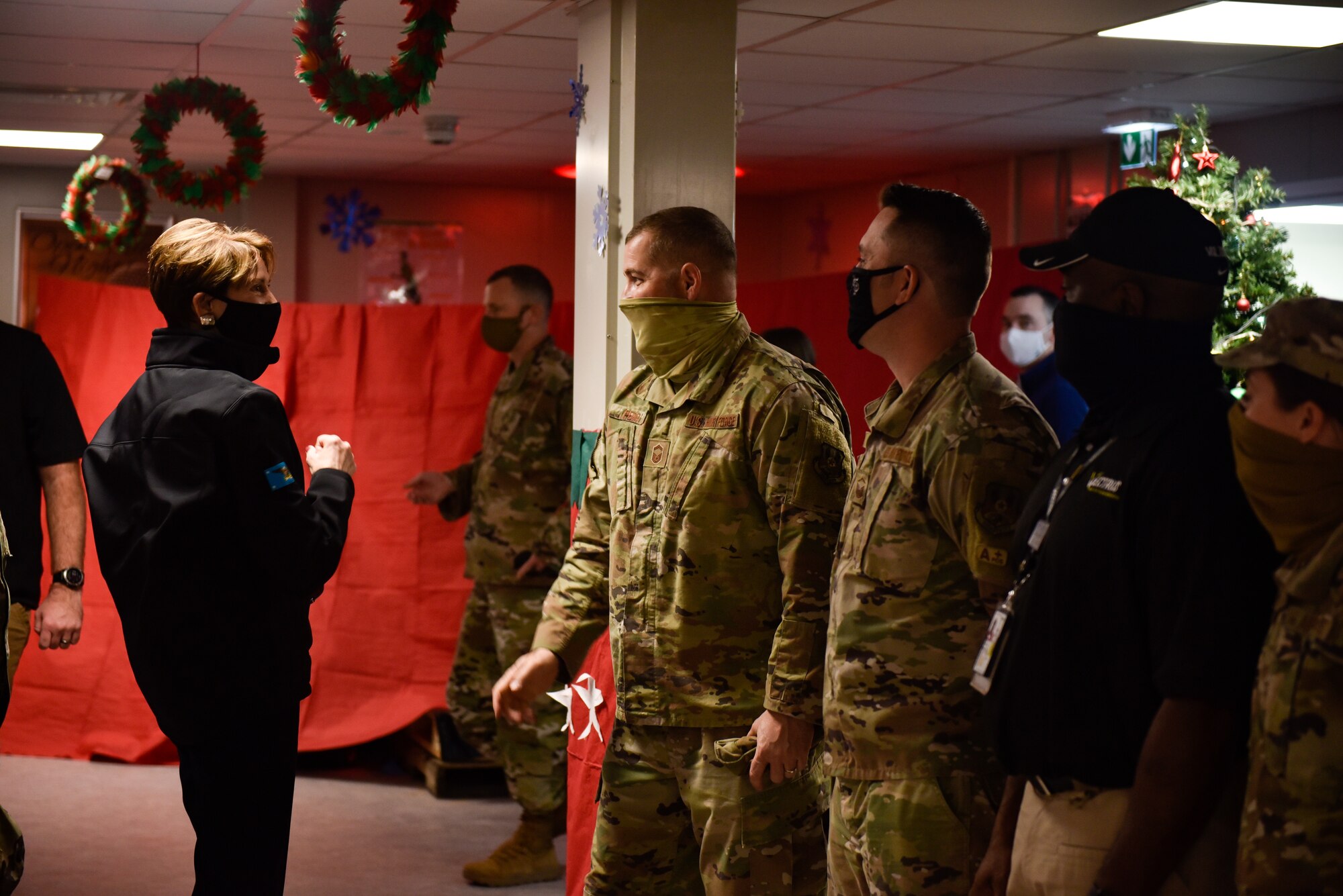 Secretary of the Air Force Barbara Barrett talks with Airmen assigned to the 386th Expeditionary Force Support Squadron at Ali Al Salem Air Base, Kuwait, Dec. 22, 2020. During their visit, senior leaders gained insight about ASAB’s mission as the tactical airlift hub and gateway for delivering combat power to joint and coalition forces in the U.S. Central Command area of responsibility. (U.S. Air Force photo by Staff Sgt. Kenneth Boyton)