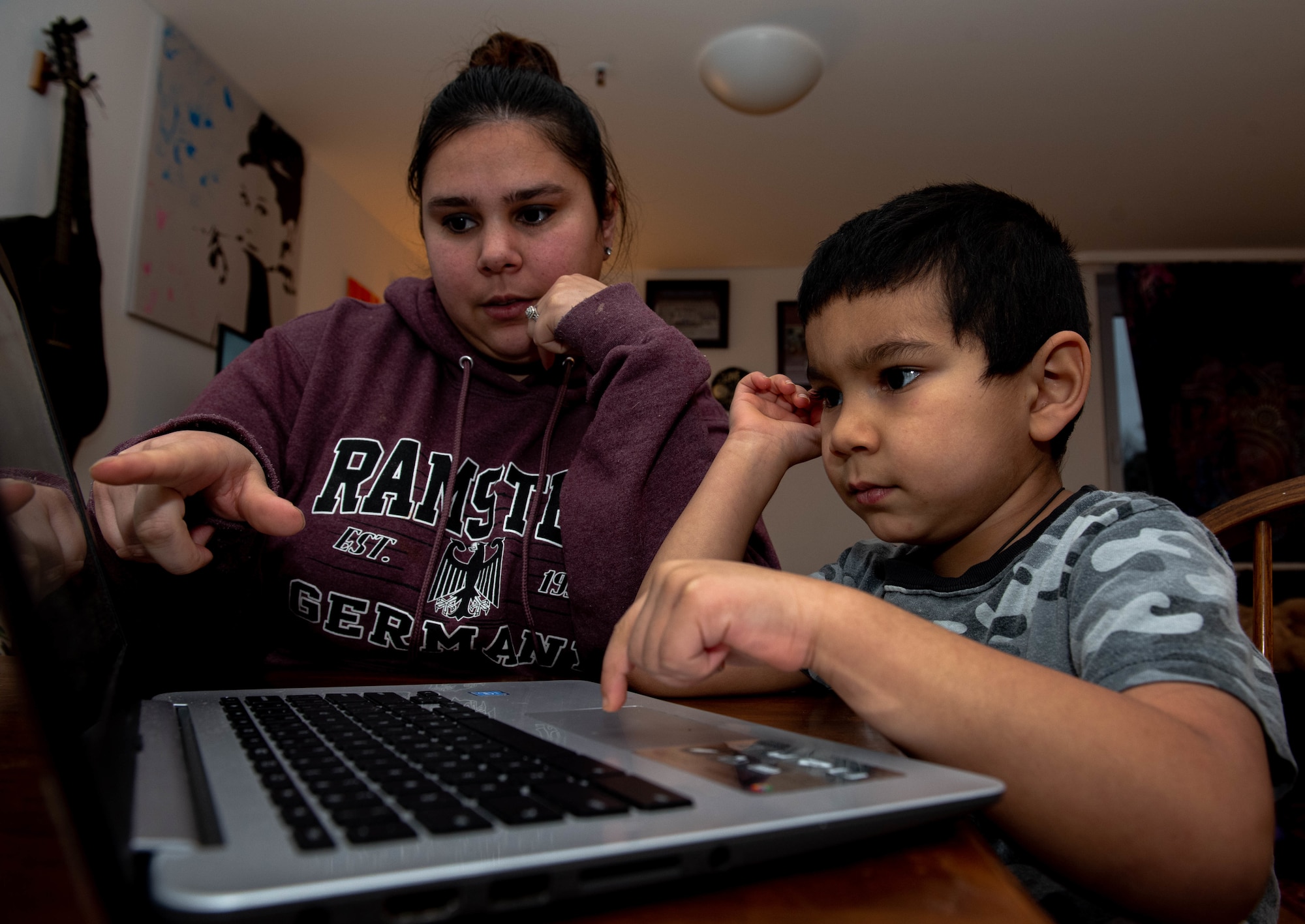 Photo of mother and son doing homework