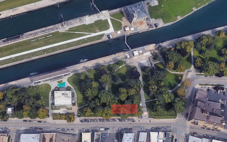The highlighted area shows the proposed location for a 50-foot by 120-foot temporary office space in Canal Park on the Soo Locks property in Sault Ste. Marie, Michigan. The proposed one-story structure will house Corps employees overseeing the New Lock at the Soo project construction. Project officials say it will have an attractive, semi-permanent look, unlike a typical construction site.