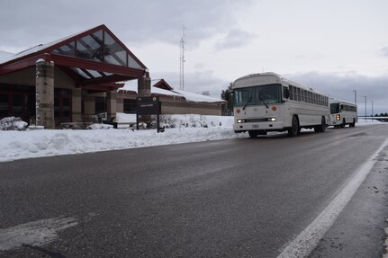 Deploying Airmen arrive at Alpena Combat Readiness Training Center in Michigan Dec. 16, 2020. The Michigan Air National Guard facility was selected by the Air Force’s active-duty component to serve as a site for Airmen to spend two weeks in a controlled environment to ensure they do not have COVID-19 before traveling to their overseas assignments.