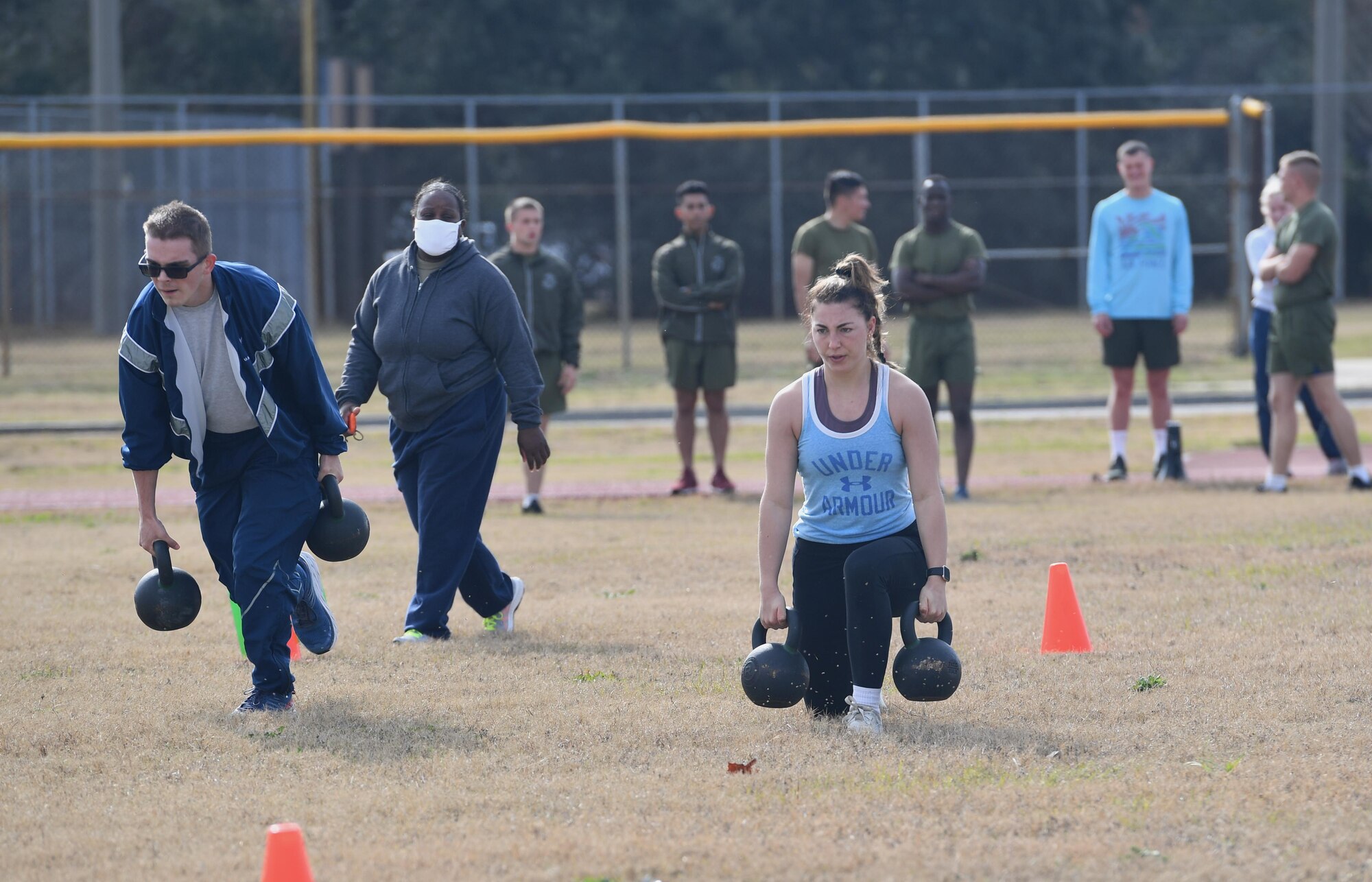 U.S. Air Force Airmen Teagan Day, 336th Training Squadron, and Bailey Woods, 334th Training Squadron, participate in a reindeer games fitness challenge at Keesler Air Force Base, Mississippi, Dec. 23, 2020. The 81st Training Group held various events for Airmen to participate in throughout the holidays, to include ice skating, inflatables, a scavenger hunt and a bubble ball soccer tournament. (U.S. Air Force photo by Kemberly Groue)