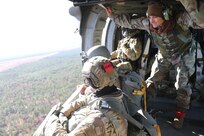 U.S. Army paratroopers jumping from a UH-60 Black Hawk at Sicily Drop Zone, Fort Bragg, N.C., Dec. 3, 2020, during non-tactical airborne operations hosted by the Army Reserve's U.S. Army Civil Affairs and Psychological Operations Command (Airborne) and the 82nd Airborne Division.