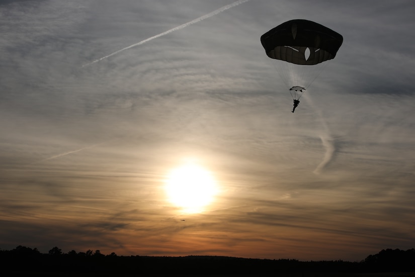 A U.S. Army paratrooper navigates to a safe landing at Sicily Drop Zone, Fort Bragg, N.C., Dec. 3, 2020, during non-tactical airborne operations hosted by the U.S. Army Reserve's U.S. Army Civil Affairs and Psychological Operations Command (Airborne) and the 82nd Airborne Division.