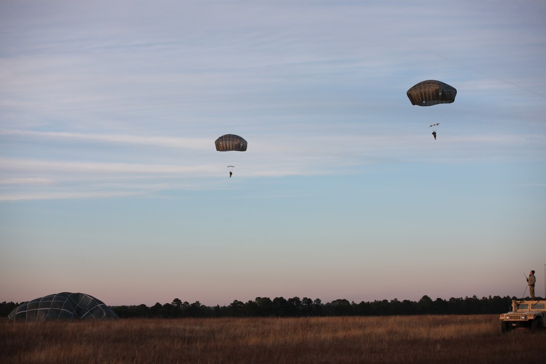 U.S. Army paratroopers navigate to a safe landing at Sicily Drop Zone, Fort Bragg, N.C., Dec. 3, 2020, during non-tactical airborne operations hosted by the U.S. Army Reserve's U.S. Army Civil Affairs and Psychological Operations Command (Airborne) and the 82nd Airborne Division.