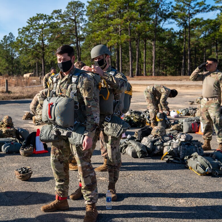 U.S. Army paratroopers prepare to conduct airborne operations at Sicily Drop Zone, Fort Bragg, N.C., Dec. 3, 2020, during non-tactical airborne operations hosted by the U.S. Army Reserve's U.S. Army Civil Affairs and Psychological Operations Command (Airborne) and the 82nd Airborne Division.