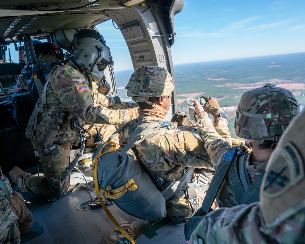 U.S. Army paratroopers prepare to conduct airborne operations at Sicily Drop Zone, Fort Bragg, N.C., Dec. 3, 2020, during non-tactical airborne operations hosted by the U.S. Army Reserve's U.S. Army Civil Affairs and Psychological Operations Command (Airborne) and the 82nd Airborne Division.