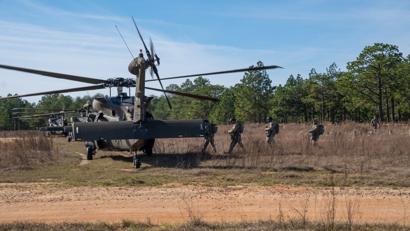 U.S. Army paratroopers prepare to conduct airborne operations at Sicily Drop Zone, Fort Bragg, N.C., Dec. 3, 2020, during non-tactical airborne operations hosted by the U.S. Army Reserve's U.S. Army Civil Affairs and Psychological Operations Command (Airborne) and the 82nd Airborne Division.