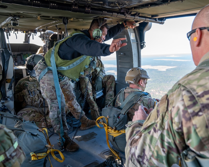 U.S. Army paratroopers prepare to conduct airborne operations at Sicily Drop Zone, Fort Bragg, N.C., Dec. 3, 2020, during non-tactical airborne operations hosted by the U.S. Army Reserve's U.S. Army Civil Affairs and Psychological Operations Command (Airborne) and the 82nd Airborne Division.