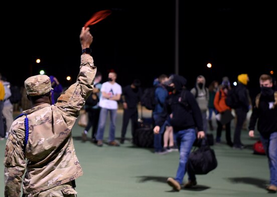 Students’ bags wait in rows to be picked up before boarding busses during Exodus at the Mathis Fitness Center on Goodfellow Air Force Base, Texas, Dec. 22, 2020. Bags were separated by bus to make the process as efficient as possible. (U.S. Air Force photo by Airman 1st Class Ethan Sherwood)