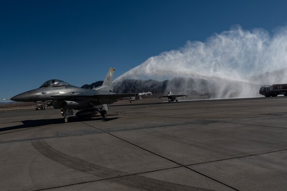 Aircraft driving under waterfall.
