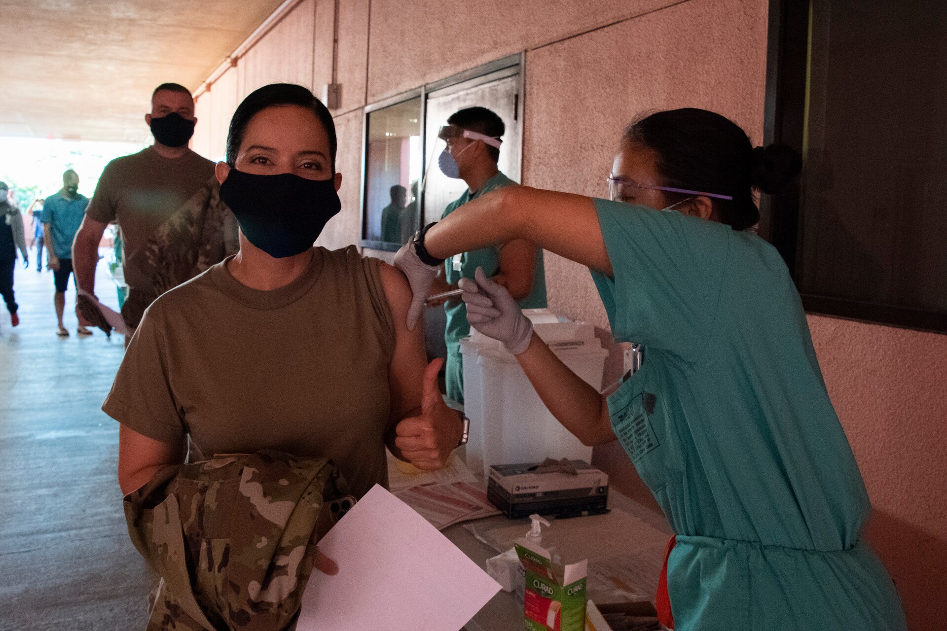 Col. Elba Villacorta, commander of Public Health Command-Pacific, receives the Pfizer vaccine at Tripler Army Medical Center, Honolulu, on Dec. 23, 2020. The inoculation was part of the Department of Defense COVID-19 vaccine distribution and administration plan that is a phased, standardized and coordinated strategy for prioritizing, distributing, and administering COVID-19 vaccines to protect DoD personnel, maintain readiness, and support the national COVID-19 response. (U.S. Army photo by Amber E. Kurka)