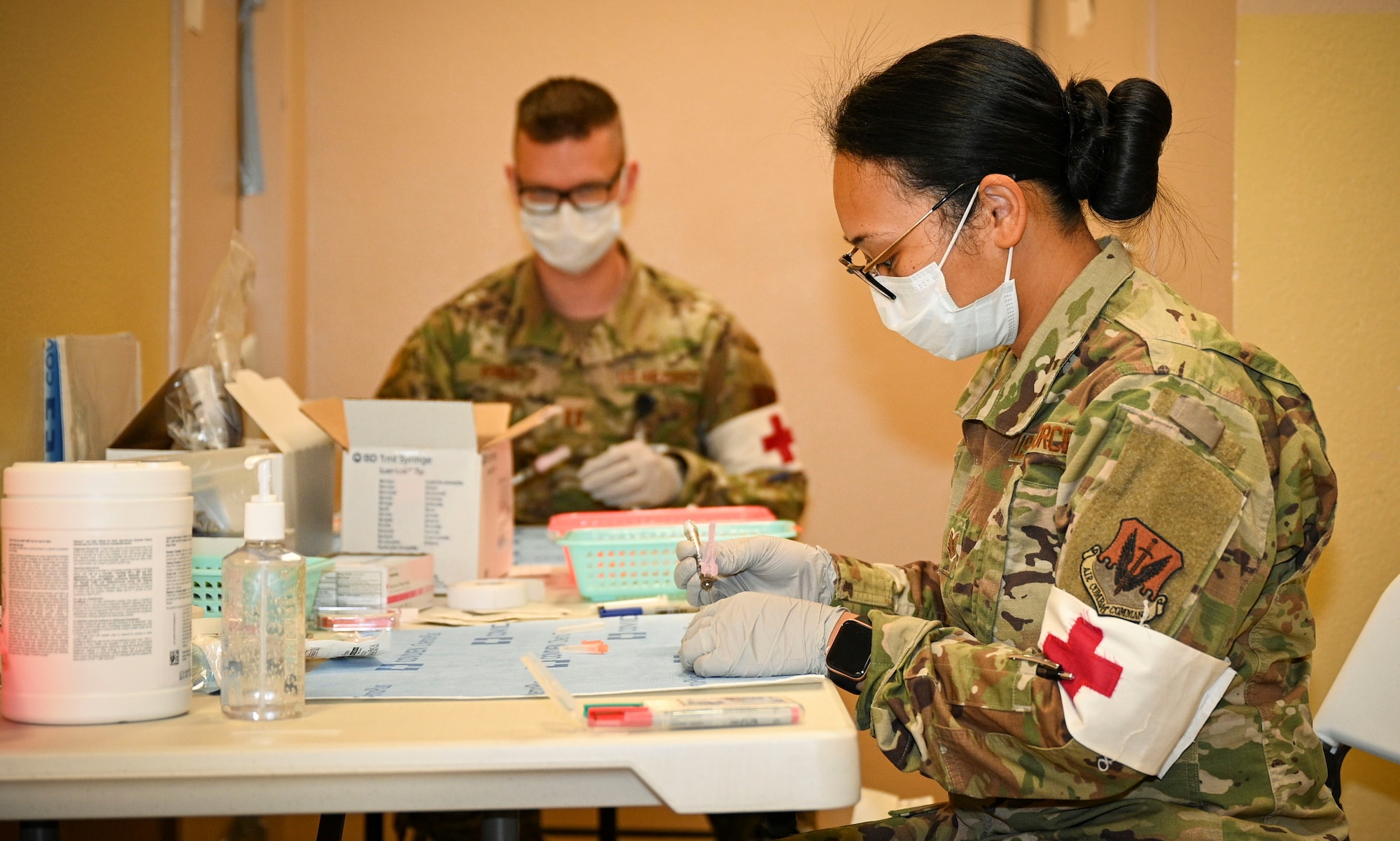 Technician prepares vaccine.