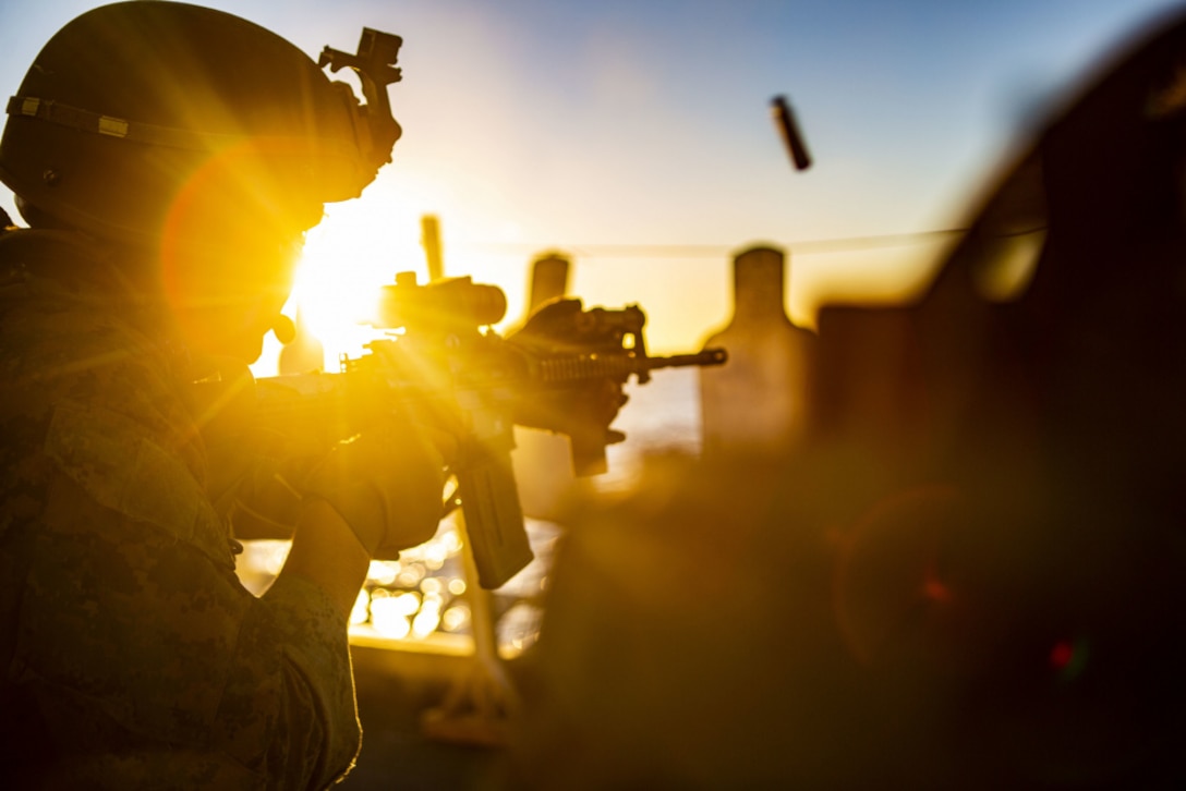 201114-M-UV498-1422 PACIFIC OCEAN (Nov. 14, 2020) – A U.S. Marine with the All-Domain Reconnaissance Detachment, 15th Marine Expeditionary Unit, fires his M4 carbine during a combat marksmanship exercise on the flight deck of the amphibious assault ship USS Makin Island (LHD 8). The Makin Island Amphibious Ready Group and the 15th MEU are currently conducting routine operations in the U.S. 3rd Fleet area of operations. (U.S. Marine Corps photo by Lance Cpl. Mackenzie Binion)