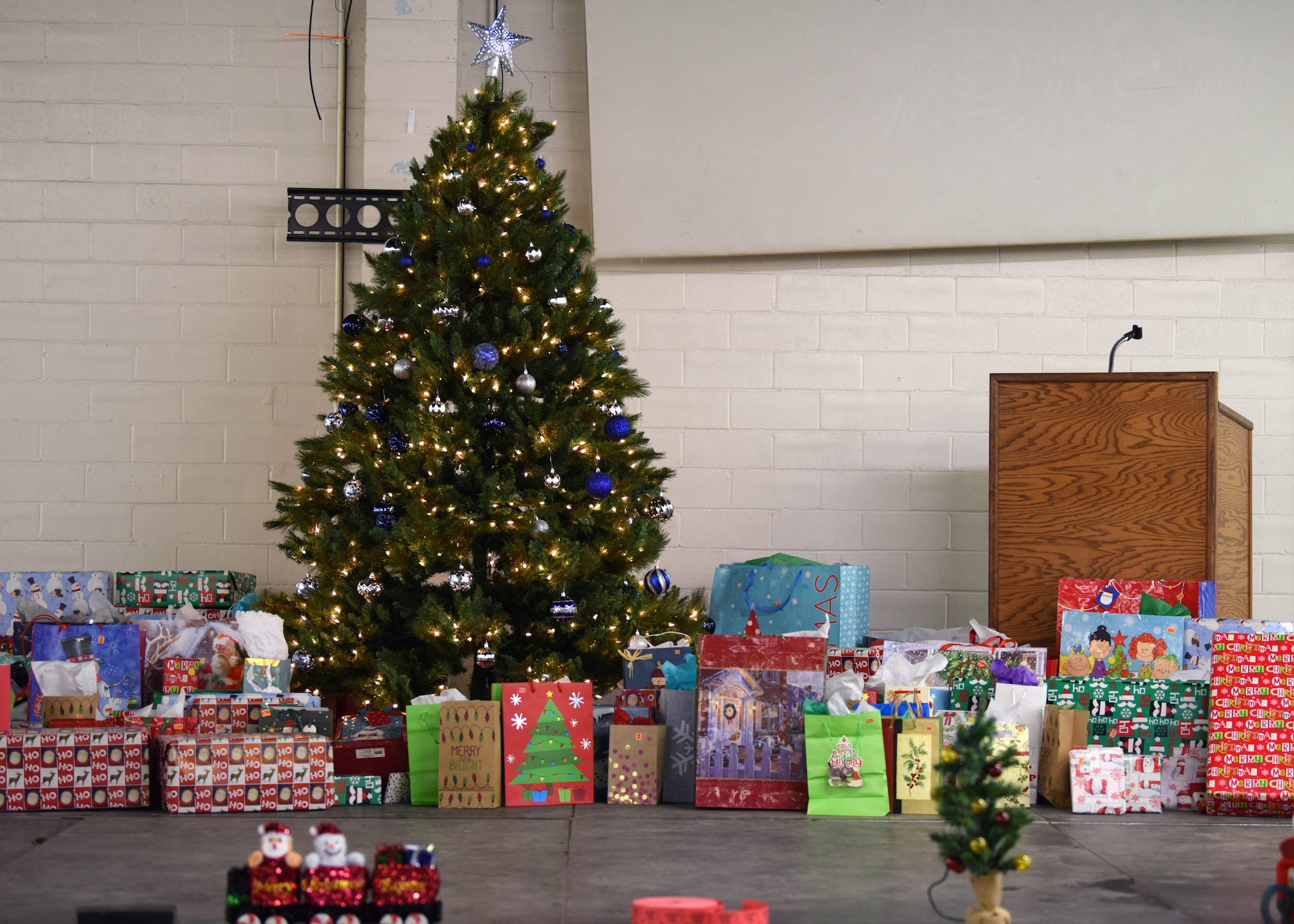 Gifts donated by the city of San Angelo and the Elks Lodge wait to be chosen at the Home Away From Home event in the First Financial Pavilion in San Angelo, Texas, Dec. 25, 2020. Military members drew numbers and chose gifts when their number was called. (U.S. Air Force photo by Airman 1st Class Ethan Sherwood)