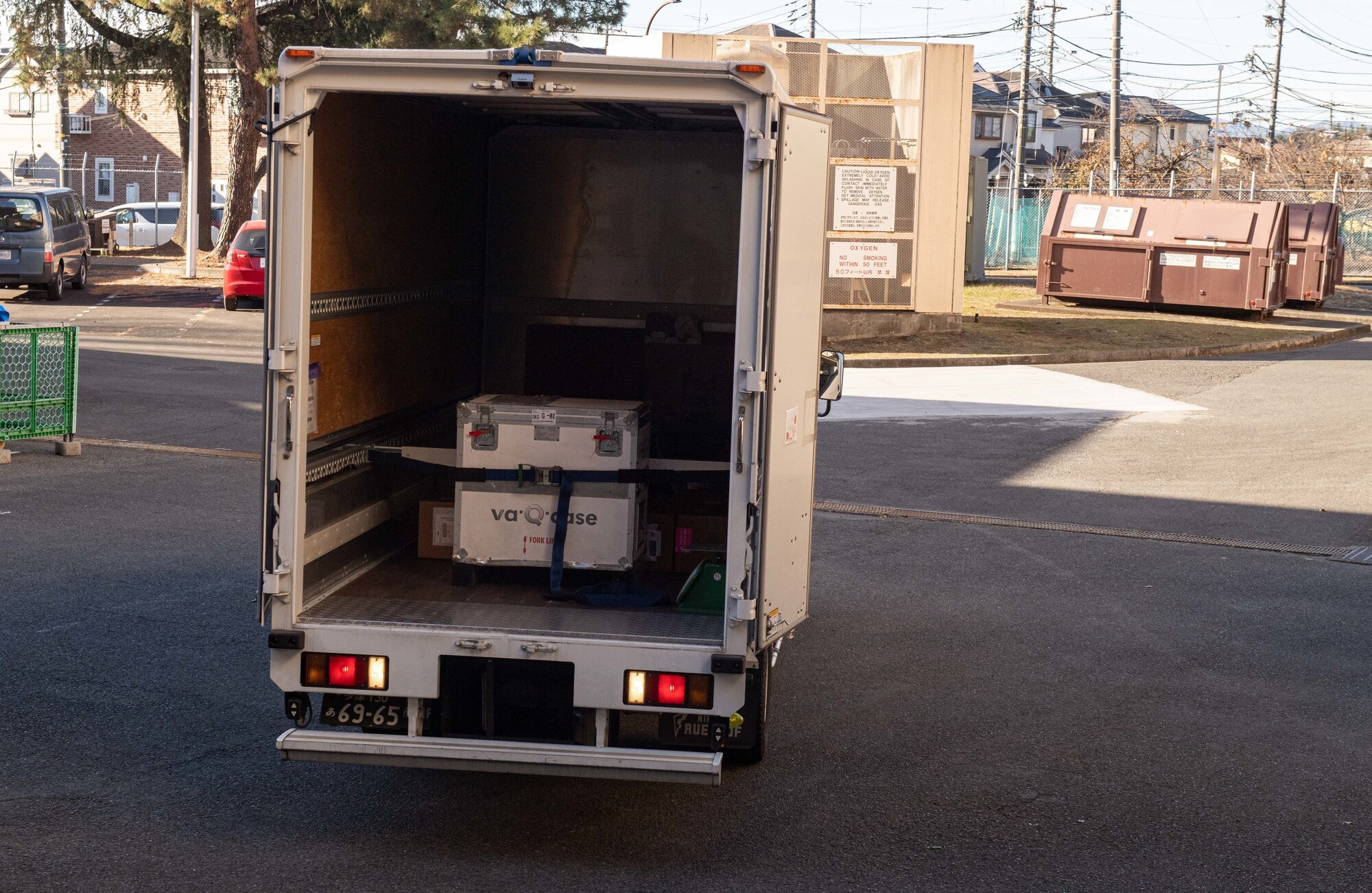 A delivery truck arrives with the first wave of Moderna COVID-19 vaccines at Yokota Air Base