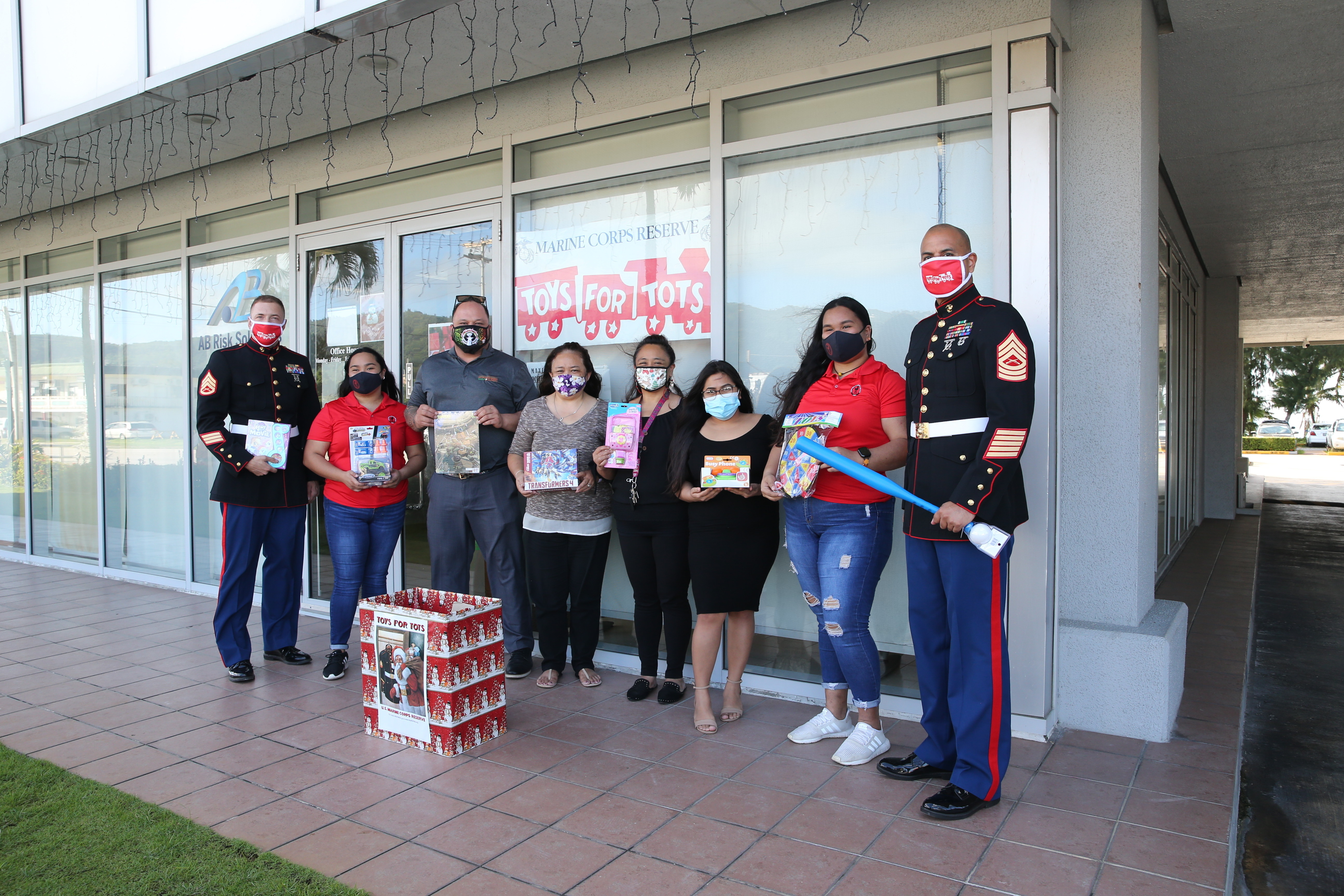 U.S. Marines with Marine Corps Base (MCB) Camp Blaz pose for photos with the Associated Students of Northern Marianas College, Saipan Young Professionals and local businesses during the annual Toys for Tots campaign on Saipan on Dec. 17, 2020.
