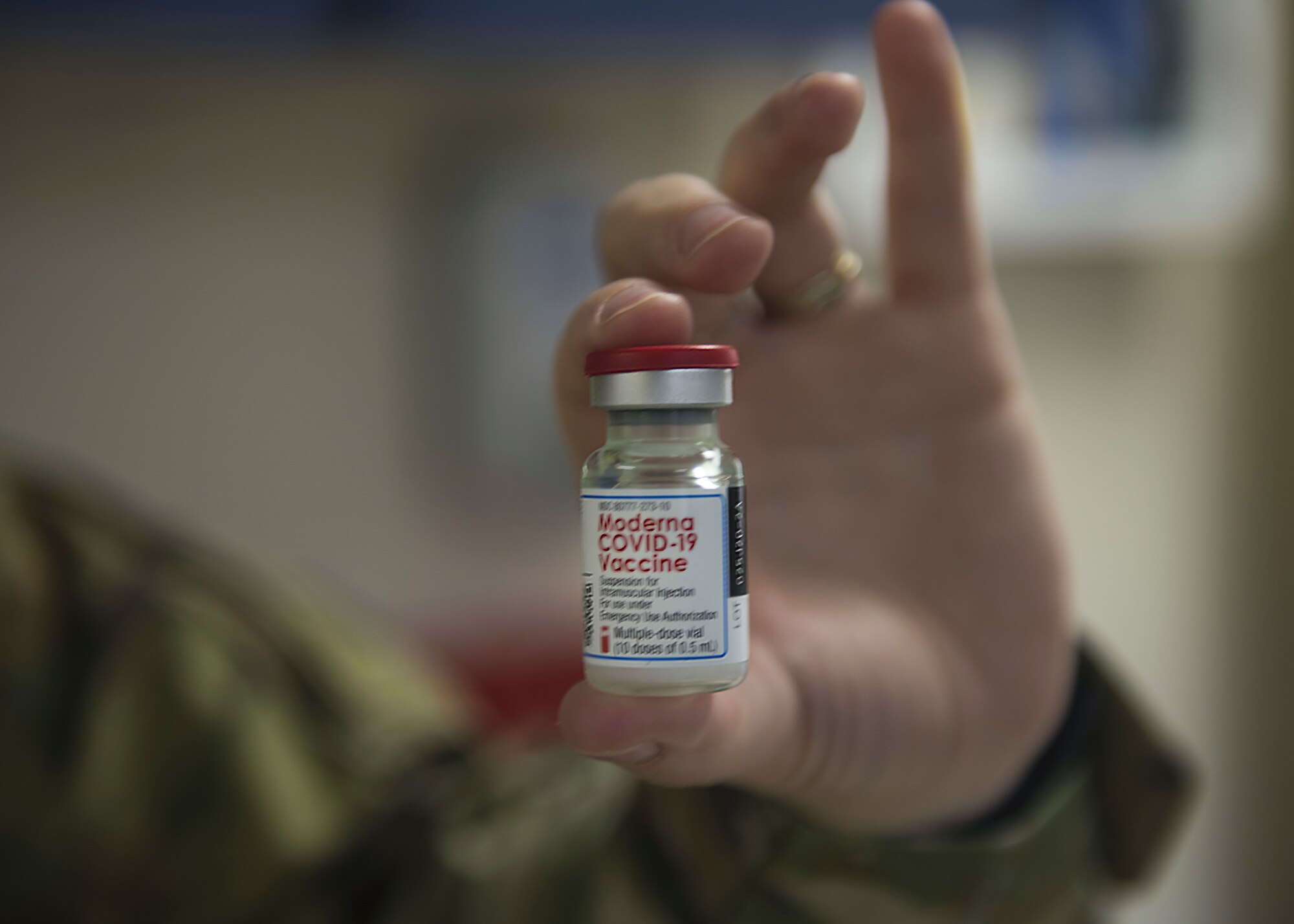 A 35th Medical Group Airman holds a dosage of the COVID-19 vaccine in preparation to deliver it to mission essential personnel at Misawa Air Base, Japan, Dec. 28, 2020. The 35th MDG Public Health office will notify the base population when the vaccine is available for distribution to additional service members, government civilians, dependents and Department of Defense beneficiaries at Misawa AB. (U.S. Air Force photo by Airman 1st Class Leon Redfern)