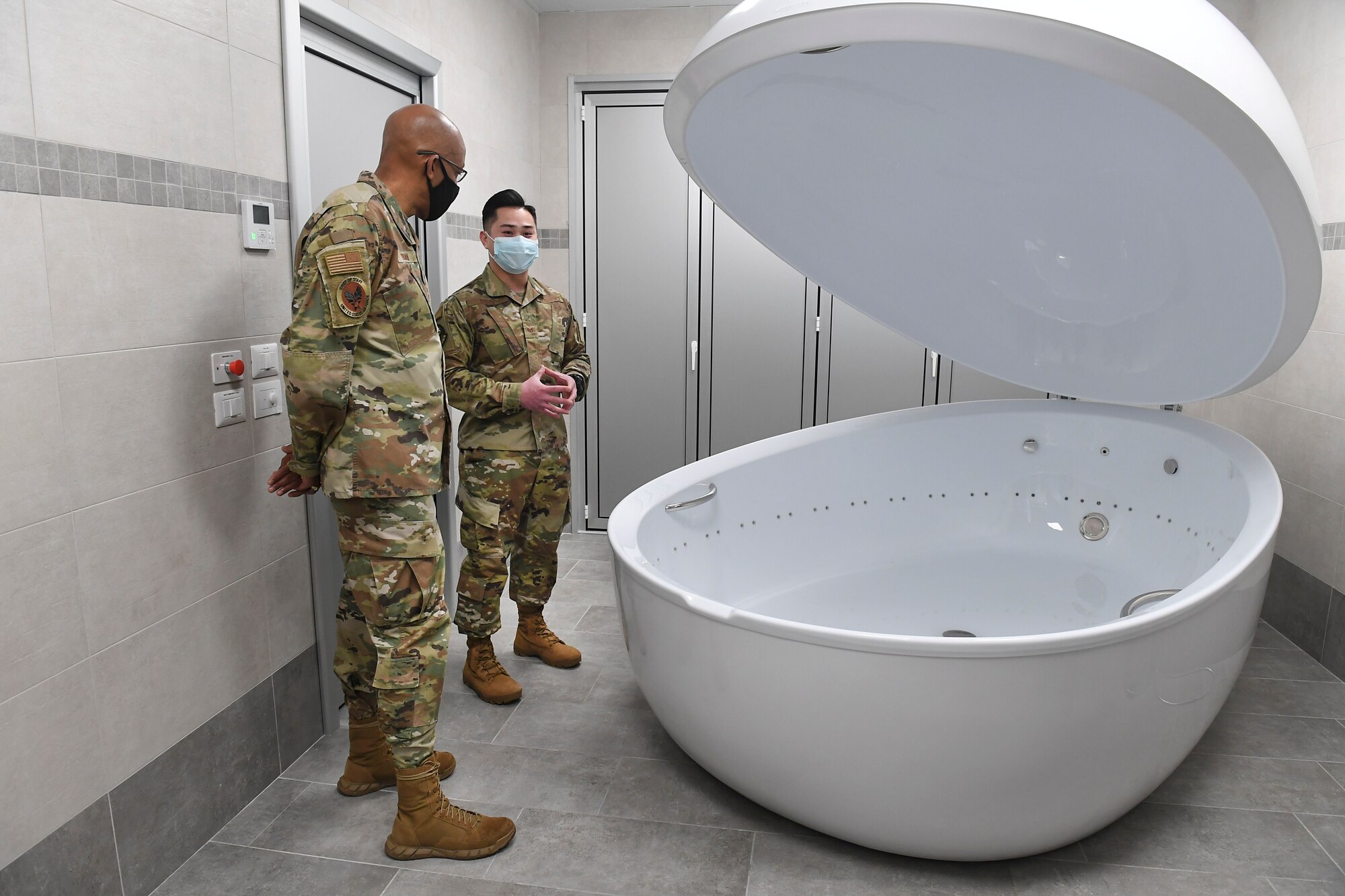 Air Force Chief of Staff Gen. Charles Q. Brown, Jr. tours the Comprehensive Operational Medicine for Battle Ready Airmen (COBRA) Clinic and receives briefs about several different programs at Aviano Air Base, Italy, Dec. 23, 2020. During the tour of the clinic, Brown was shown a sensory deprivation tank and was briefed on new innovative ideas, such as incorporating diagnosis, recovery, rehabilitation, and performance optimization into a single unified mission.  (U.S. Air Force photo by Staff Sgt. Valarie Halbert)