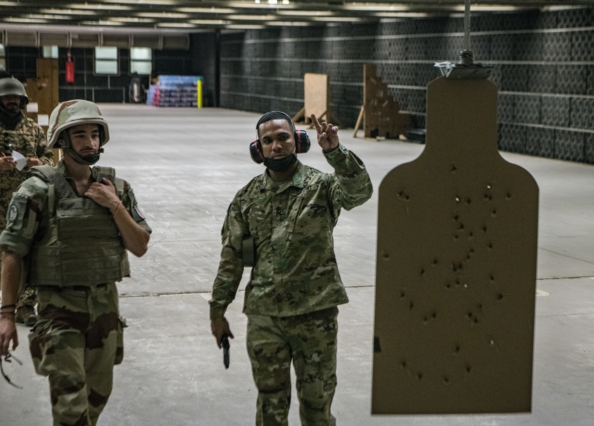 airmen look at a target