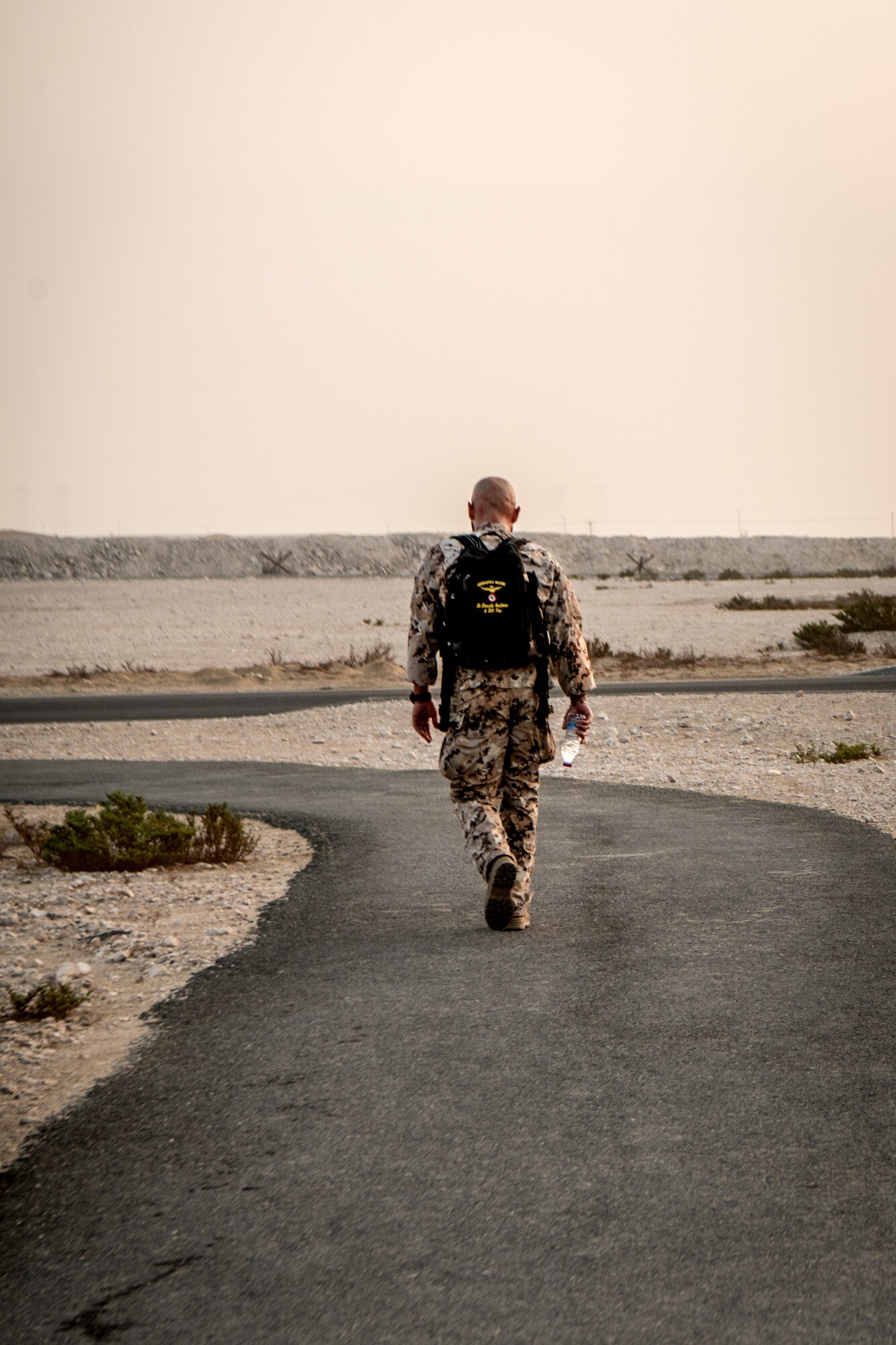 a man walks down a path