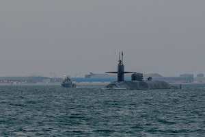 201227-A-RX269-1066 GULF OF BAHRAIN (Dec. 27, 2020) The guided-missile submarine USS Georgia (SSGN 729) transits the Gulf of Bahrain, outbound from a sustainment and logistics visit in Manama, Bahrain, Dec. 27. Georgia is deployed to the U.S. 5th Fleet area of operations in support of naval operations to ensure maritime stability and security in the Central Region, connecting the Mediterranean and Pacific through the Western Indian Ocean and three critical chokepoints to the free flow of global commerce.