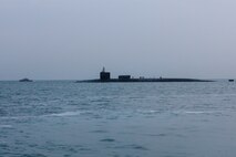 201227-A-RX269-1159 GULF OF BAHRAIN (Dec. 27, 2020) The guided-missile submarine USS Georgia (SSGN 729) transits the Gulf of Bahrain, outbound from a sustainment and logistics visit in Manama, Bahrain, Dec. 27. Georgia is deployed to the U.S. 5th Fleet area of operations in support of naval operations to ensure maritime stability and security in the Central Region, connecting the Mediterranean and Pacific through the Western Indian Ocean and three critical chokepoints to the free flow of global commerce.
