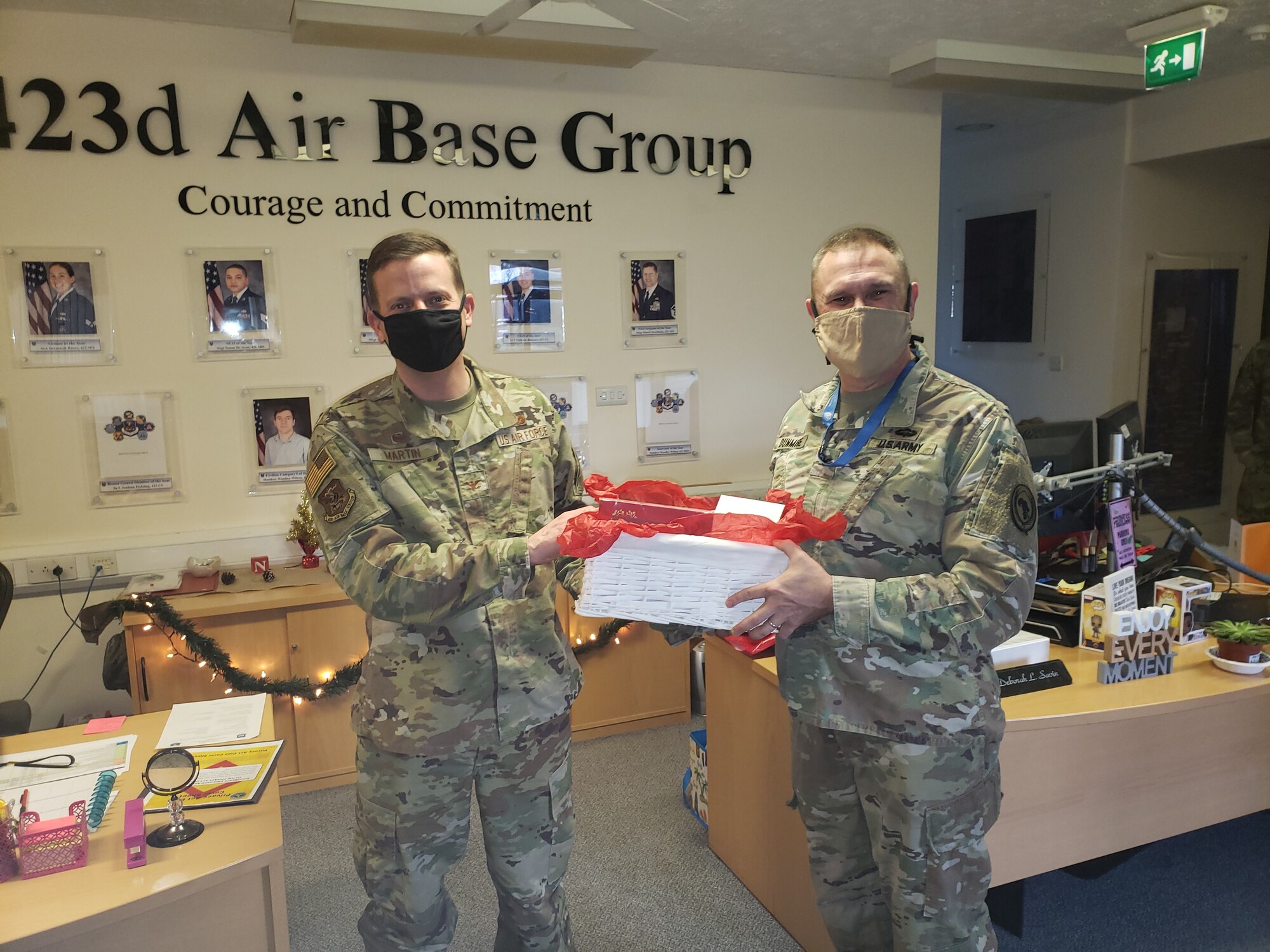 Col Brian R. Dunmire, USAFRICOM J2-Molesworth Director/Multi-Service commander delivers a holiday gift basket to Col Rick Martin, 423rd ABG Commander and his staff.  The gift basket reflects USAFRICOM's appreciation for the 423rd 'Lighting the Way' in 2020." (Courtesy Photo)