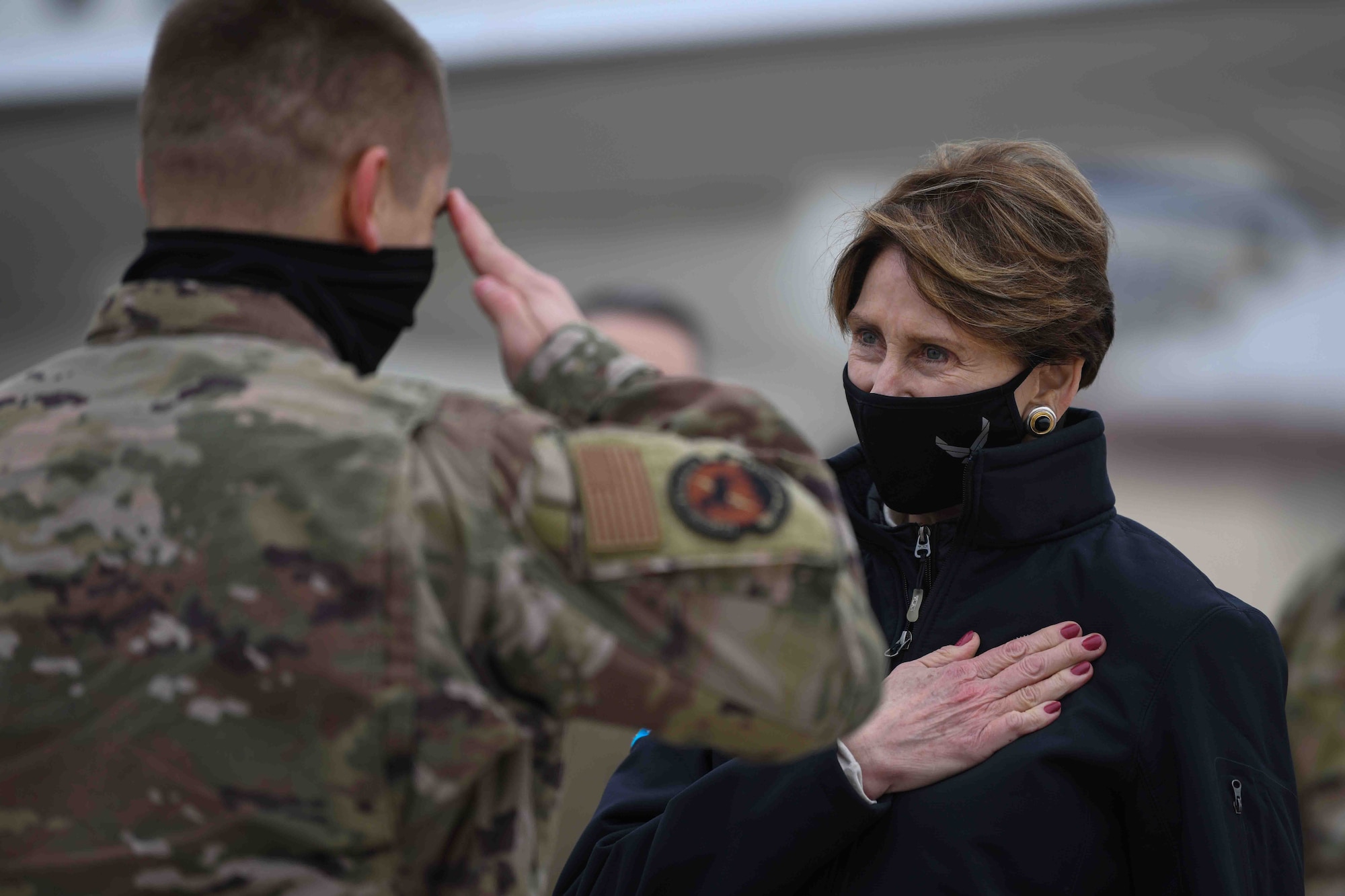 Secretary of the Air Force Barbara M. Barrett speaks to an Airman from the 31st Fighter Wing before she departs Aviano Air Base, Italy, Dec. 23, 2020. During her visit she listened to 31st FW’s mission briefs and coined multiple exceptional Airmen. (U.S. Air Force photo by Airman 1st Class Ericka A. Woolever)