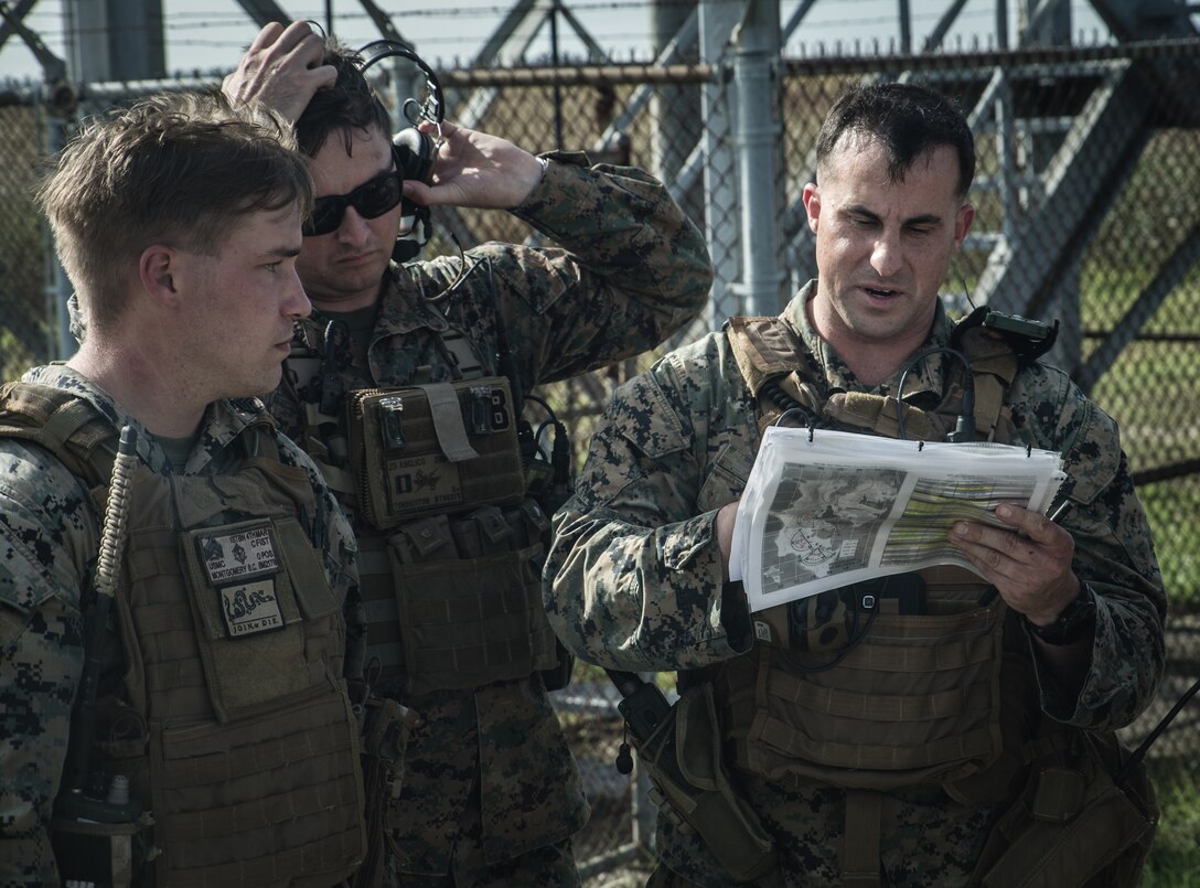 U.S. Marine Lance Cpl. Peter Tubiolo, a radio operator with Second Air-Naval Gunfire Liaison Company (2D ANGLICO) conducts a radio check during a Joint Terminal Attack Controller training exercise at Bombing Target 11, at Piney Island, North Carolina, Oct. 20, 2020.
