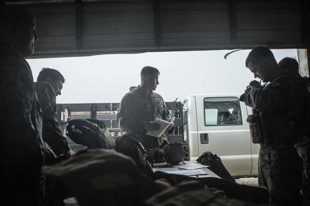 U.S. Marine Lance Cpl. Peter Tubiolo, a radio operator with Second Air-Naval Gunfire Liaison Company (2D ANGLICO) conducts a radio check during a Joint Terminal Attack Controller training exercise at Bombing Target 11, at Piney Island, North Carolina, Oct. 20, 2020.