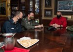 Rear Admiral Jim Kirk, commander, Carrier Strike Group 11 (right), Capt. Max Clark, commanding officer of the aircraft carrier USS Nimitz (CVN 68), and Chief Hull Technician (Select) Curtis Eicher participate in a phone call with Vice President Mike Pence aboard Nimitz. Nimitz, the flagship of Nimitz Carrier Strike Group, is deployed to the U.S. 5th Fleet area of operations to ensure maritime stability and security in the Central Region, connecting the Mediterranean and Pacific through the Western Indian Ocean and three critical chokepoints to the free flow of global commerce.