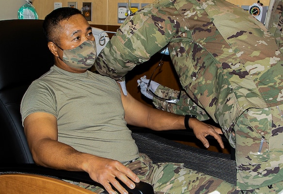 Command Sgt. Maj. Walter A. Tagalicud, Senior Enlisted Advisor for United States Forces Korea, receives the COVID-19 vaccine at Brian D. Allgood Army Community Hospital.