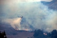 A San Diego Sheriff Bell 205 A1 fire and rescue helicopter drops water in an effort to extinguish the Creek Fire on Camp Pendleton, Calif., Dec. 24.